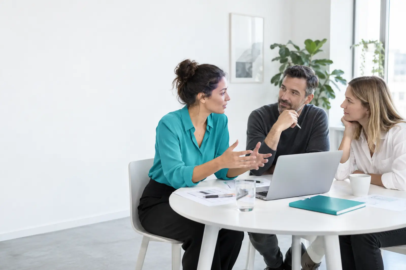 Professionals discussing a customer journey in a bright working studio
